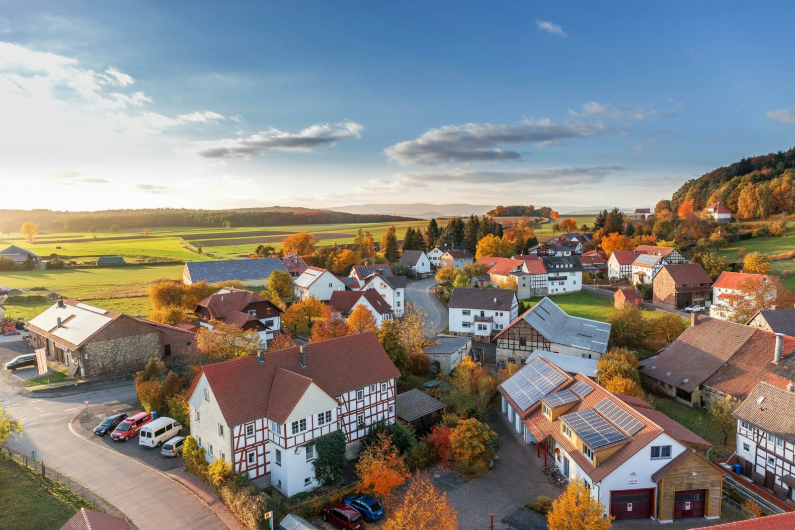 Photo by Pixabay - Czyste Powietrze - Audyty Charming aerial view of a rural village in autumn with vivid colors and clear skies.